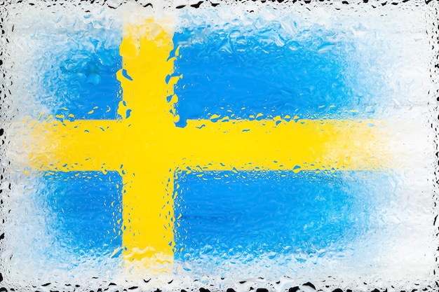 Sweden flag Flag of Sweden on the background of water drops Flag with raindrops Splashes on glass