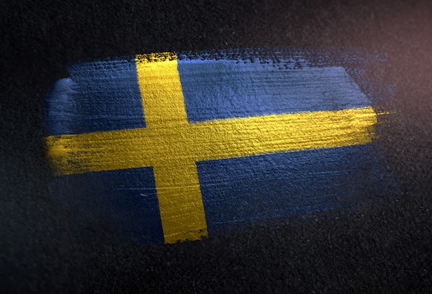 Photo sweden flag made of metallic brush paint on grunge dark wall