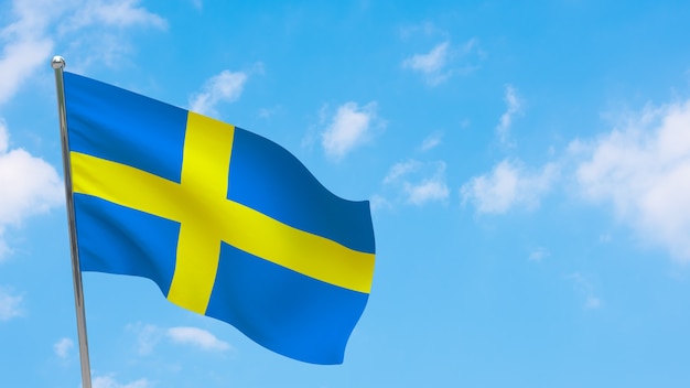 Sweden flag on pole. Blue sky. National flag of Sweden