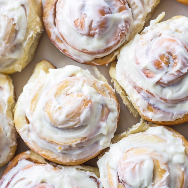 Swedish cinnamon rolls with white cream on top