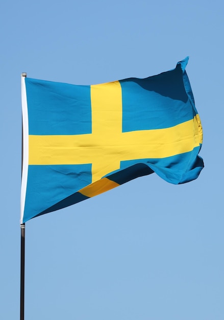 Swedish flag flying on flagpole