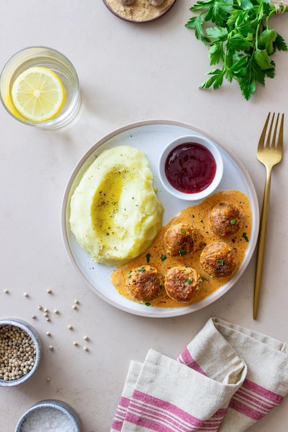 Photo swedish meatballs in cream sauce potatoes and lingonberry sauce swedish cuisine recipe
