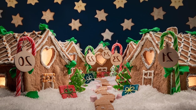 Sweet and adorable Christmas gingerbread village at night with stars