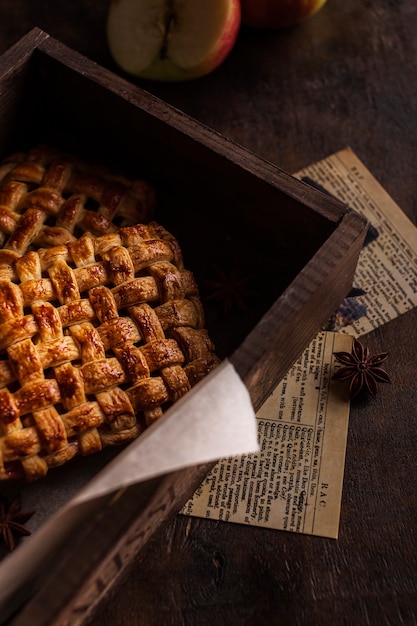 Sweet apple pie on wood