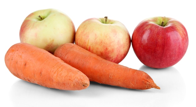 Sweet apples and carrots isolated on white