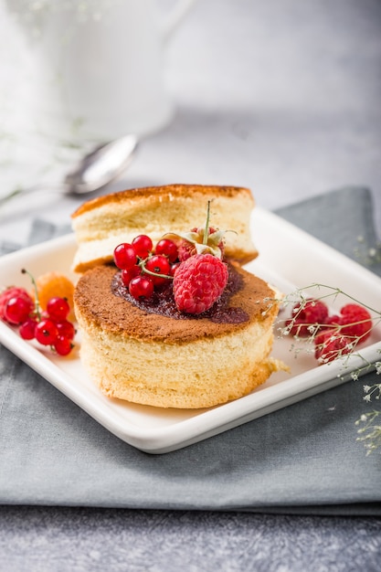 Sweet Asian cake with raspberries