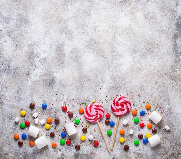 Sweet background with lollipop, candy and  marshmallow 