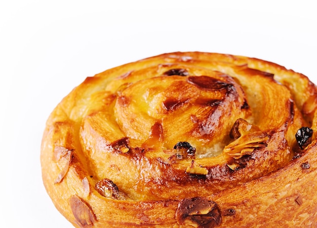 Sweet baked snail with raisins and almond