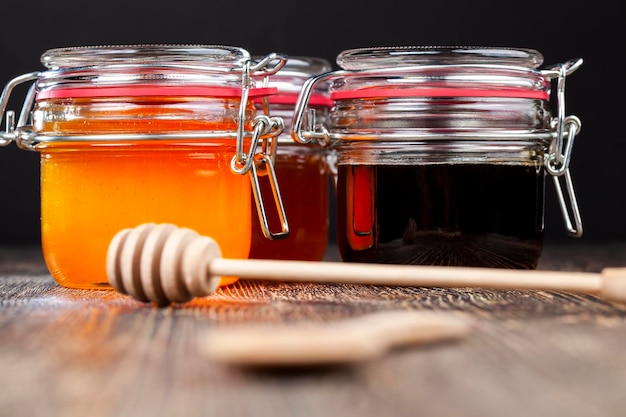 Sweet bee honey in a transparent glass jar