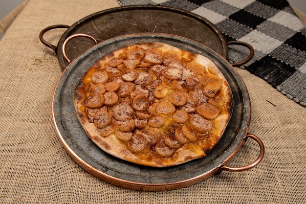 Sweet Brazilian pizza with banana, cinnamon and sugar, top view