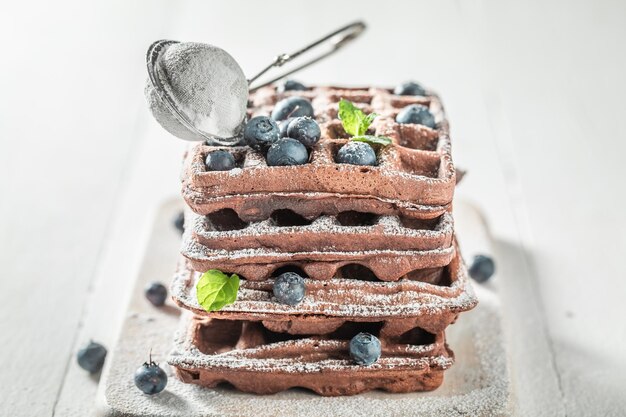 Sweet and brown dark waffles made of cocoa and fruits