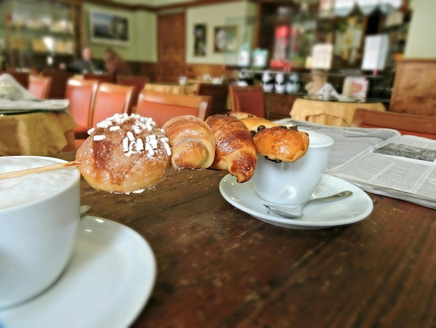 Photo sweet bun and croissants on skewer