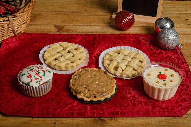 Sweet canapes and pastries on a table with Christmas decorations