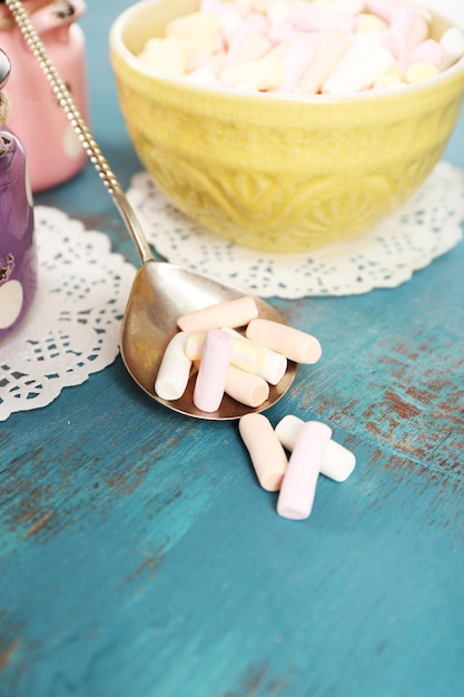 Sweet candies on wooden table closeup