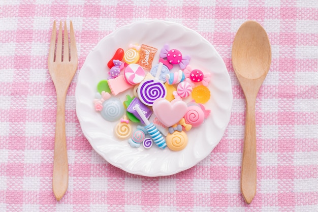 Sweet candy on plate, valentines day background. 