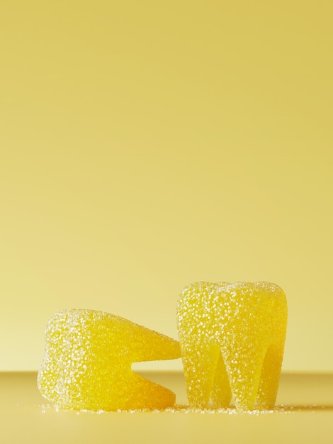 Sweet candy for unhealthy teeth . Yellow jelly teeth with sugar crystals on yellow . 3d rendering illustration.