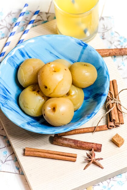 Sweet canned apples for winter in a plate