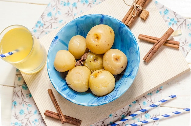 Sweet canned apples for winter in a plate