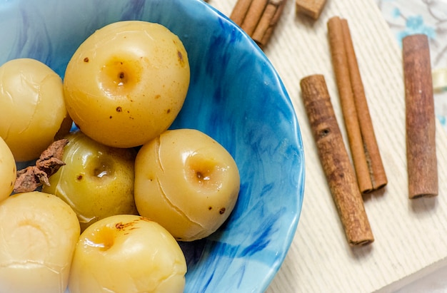 Sweet canned apples for winter in a plate