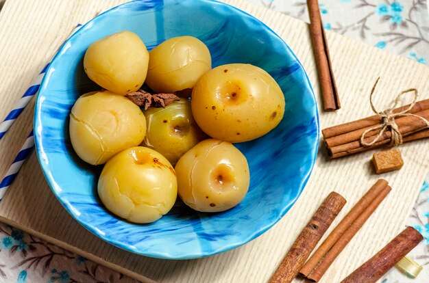 Sweet canned apples for winter in a plate