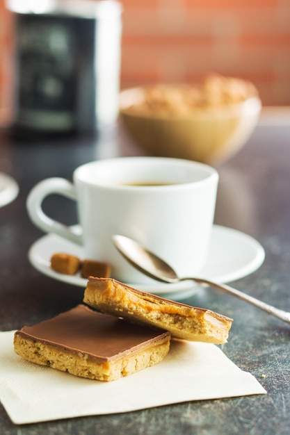 Sweet caramel dessert and coffee cup