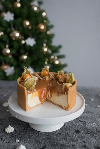 Sweet cheesecake with caramel on the table