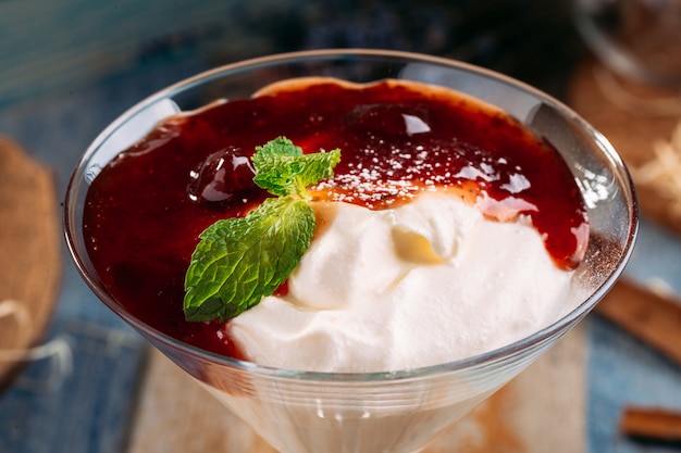 Sweet cherry jam dessert with cream martini glass