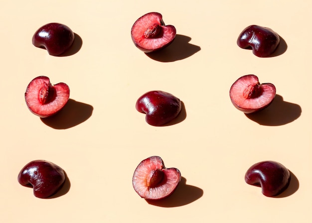 Sweet cherry on the yellow background pattern. 