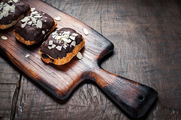 Sweet chocolate almond cake on wooden table