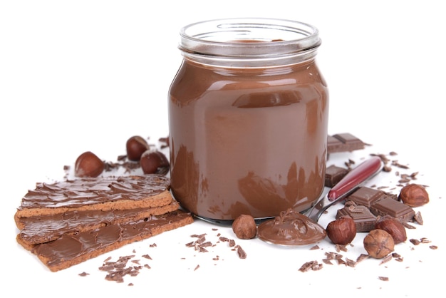 Sweet chocolate cream in jar isolated on white