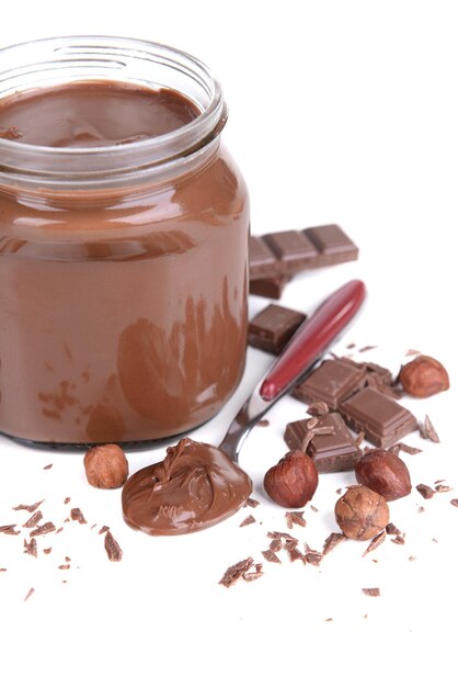 Sweet chocolate cream in jar isolated on white