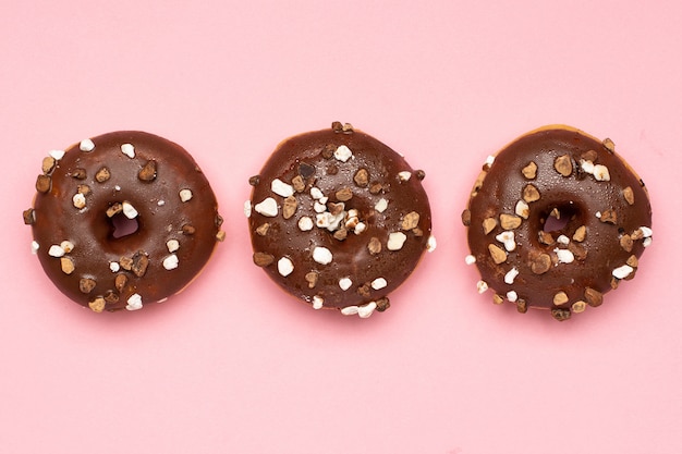 Sweet chocolate donuts with nuts