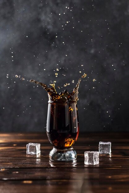 sweet cola spash in a glass