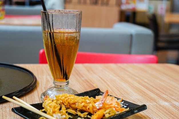 sweet cold iced tea in a transparent glass