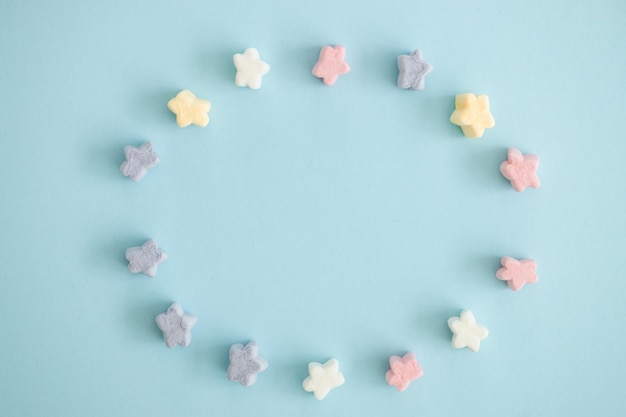 Sweet color candy in the form of stars on blue background