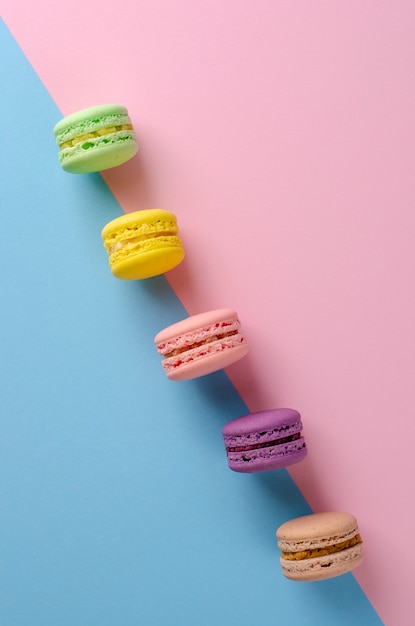 Sweet colorful cookies macaroons on colorful pastel colors