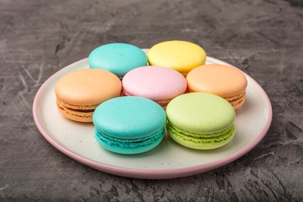 Sweet colorful macarons on the plate