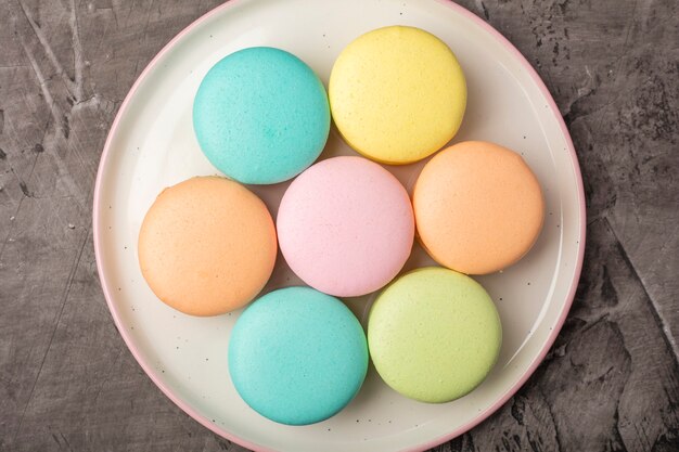 Sweet colorful macarons on the plate