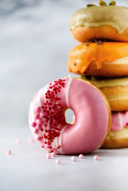 Sweet and colourful doughnuts on grey background fresh baked donuts copy space