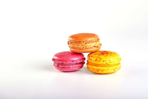 Sweet and colourful french macaroons or macaron on white