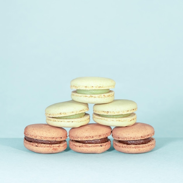 Sweet and colourful french macaroons on retrovintage background