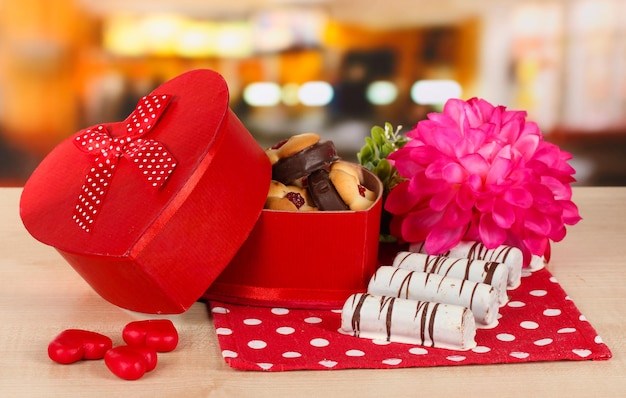 Sweet cookies in gift box on table in cafe