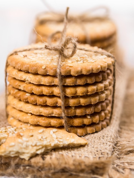 Sweet cookies with sesame seeds tied with thread