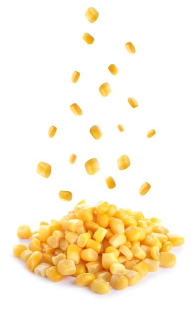 Sweet corn kernels falling on white background