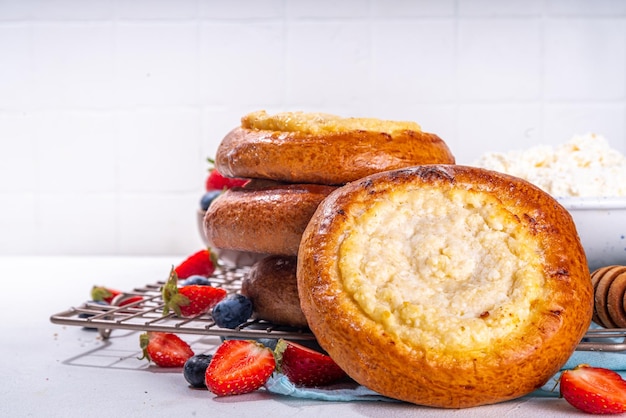 Sweet cottage cheese buns vatrushka ukrainian East Europe traditional baked dessert small open pie with cottage cheese filling