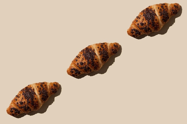 Sweet crispy croissants with chocolate pattern