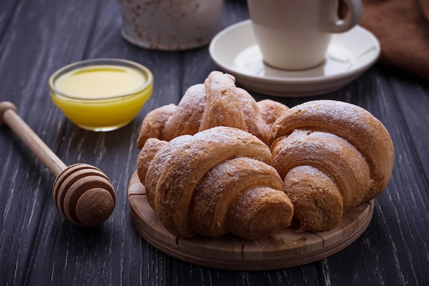 Sweet croissants, honey and coffee