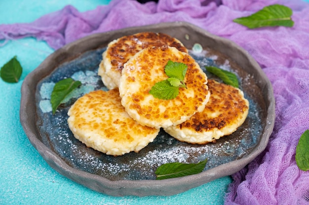 Sweet curd pancakes with mint Cottage sheese pancakes or syrniki