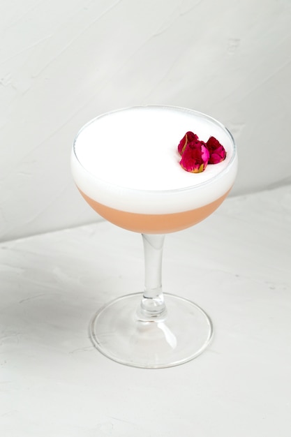 Sweet delicious sour foam cocktail with flower