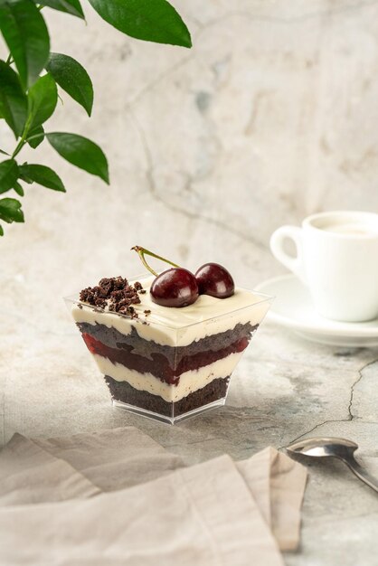 Photo sweet dessert is on the table raspberry dessert cheesecake trifle mouse in a glass